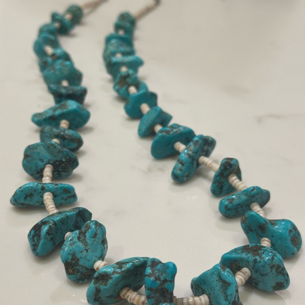 This is a chunky turquoise nugget and heishi bead necklace